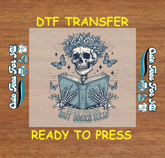 DTF transfer with skeleton holding book, flower crown, butterflies, and quote “Dead Inside But Books Help”