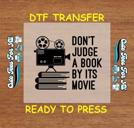 Film projector on stacked books with the quote “Don’t judge a book by its movie”