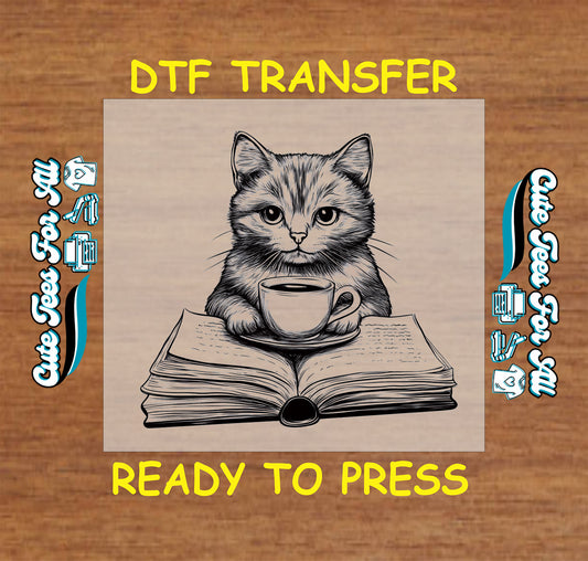 Black and white DTF transfer of a kitten with a coffee cup on an open book.
