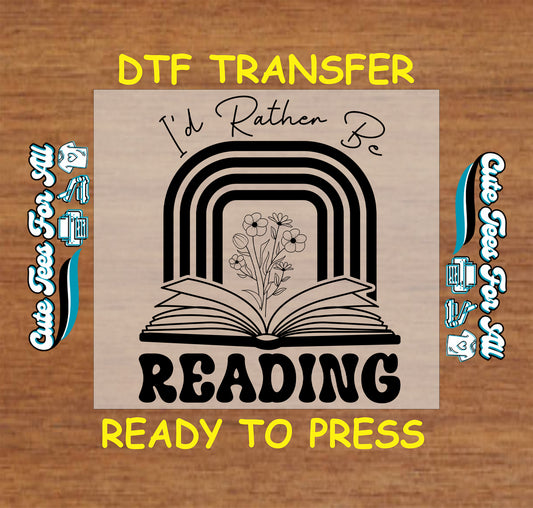 Black and white open book with rainbow and flowers and text “I'd Rather Be Reading”