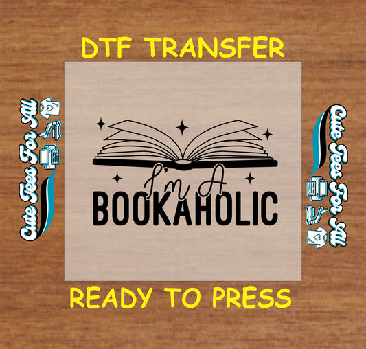 Open book with sparkles and text that says “I’m a Bookaholic”