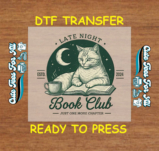 DTF transfer of cat lying on a book with a coffee cup, moon, stars, and text “Late Night Book Club – Just One More Chapter”