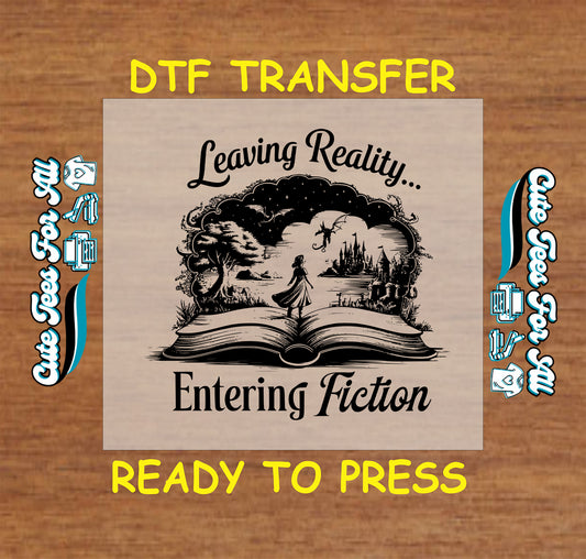 Black-and-white DTF transfer of a woman walking into a fantasy world from an open book with castles and dragons.
