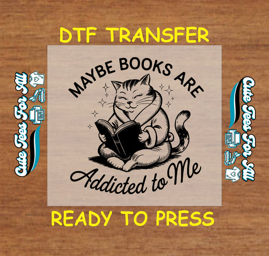 Black and white DTF transfer with smiling cat reading and text “Maybe Books Are Addicted to Me”