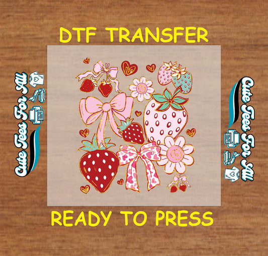 DTF transfer with strawberries, pink bows, hearts, and flowers in red, pink, and mint.