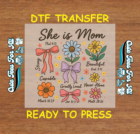 DTF transfer with text “She is Mom,” colorful flowers, bows, and Bible verses like Phil 4:13 and Matt 28:20.