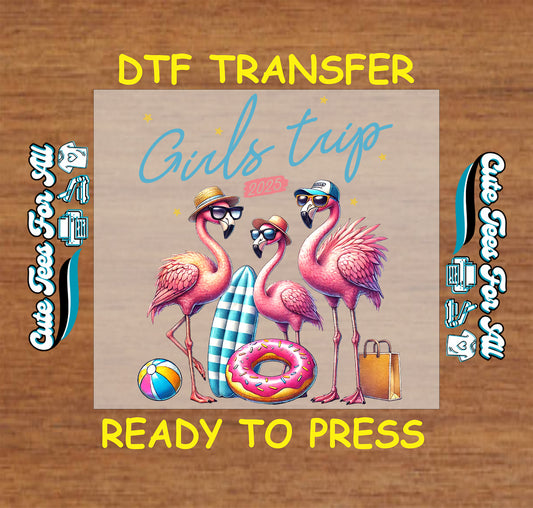 DTF transfer with flamingos, beach ball, float, and “Girls Trip 2025” text in tropical theme.