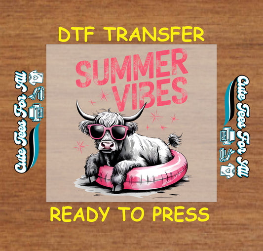 Highland cow with sunglasses in pink floatie and Summer Vibes text.