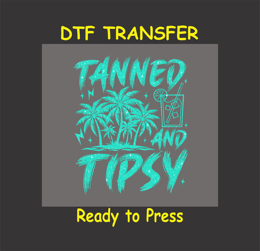 Teal tropical DTF transfer with palm trees, cocktail, and Tanned and Tipsy text.