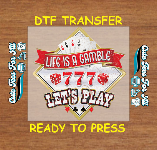 Casino-themed DTF transfer with poker cards, dice, and "Life Is a Gamble Let's Play" text.