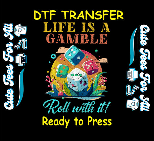 Colorful DTF transfer with tropical leaves, multicolored dice, and the phrase “Life Is a Gamble Roll with It.”
