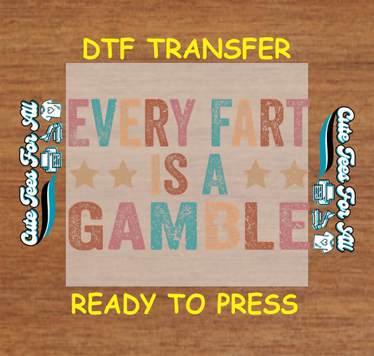 Funny DTF transfer with distressed colorful text saying “Every Fart Is a Gamble” and star accents.