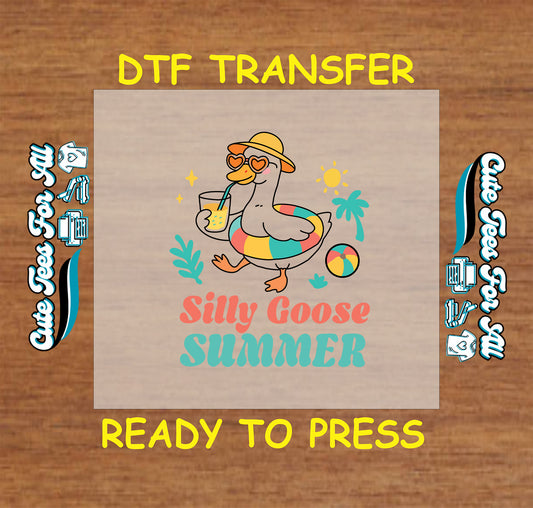 DTF transfer with a silly goose in pool ring holding lemonade with “Silly Goose Summer” text.