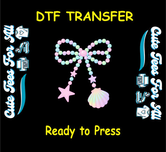DTF transfer with pastel beaded bow, starfish charm, and seashell charm in soft colors.