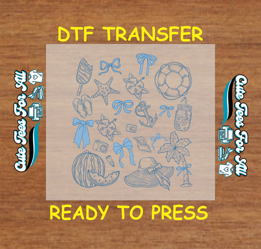 DTF transfer sheet with blue summer icons like bows, watermelon, hats, and tropical items.