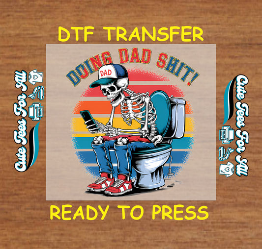 DTF transfer with skeleton dad on toilet, phone in hand, retro stripes, and text Doing Dad Sh!t.