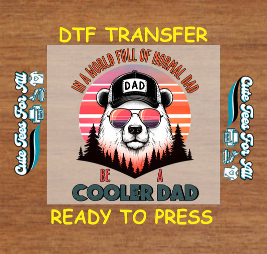 DTF transfer with bear wearing sunglasses and a DAD cap, retro sunset, and “Be a Cooler Dad” quote.