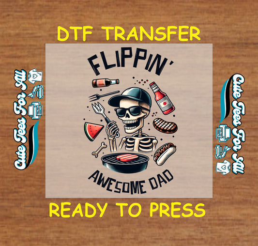 DTF transfer with skeleton dad grilling, surrounded by food and “Flippin’ Awesome Dad” text.