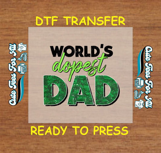 DTF transfer reading “World’s Dopest Dad” in green and black text with leaf print.