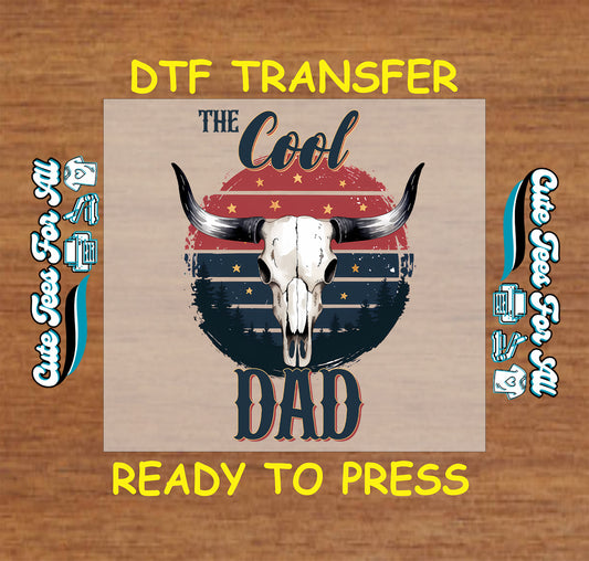 DTF transfer with longhorn skull, western sunset, and the phrase The Cool Dad.