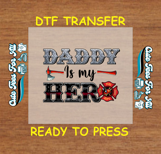 DTF transfer with "Daddy Is My Hero" text, fire axe, and firefighter emblem.