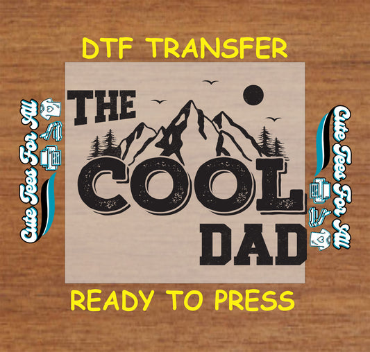 The Cool Dad text with mountain and trees in vintage black print, DTF transfer ready to press.
