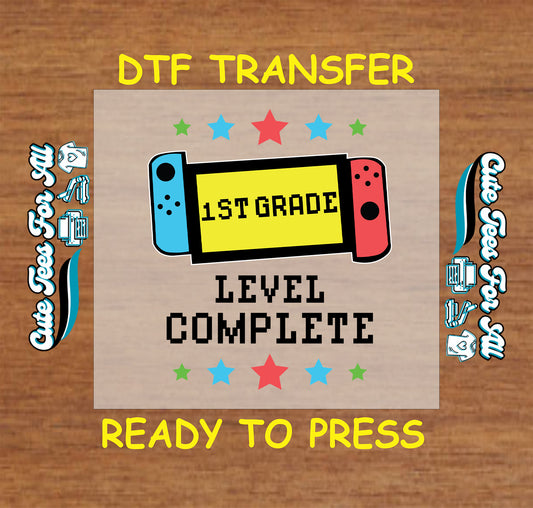 1st Grade Level Complete text with red and blue switch-style controller and stars, DTF transfer.