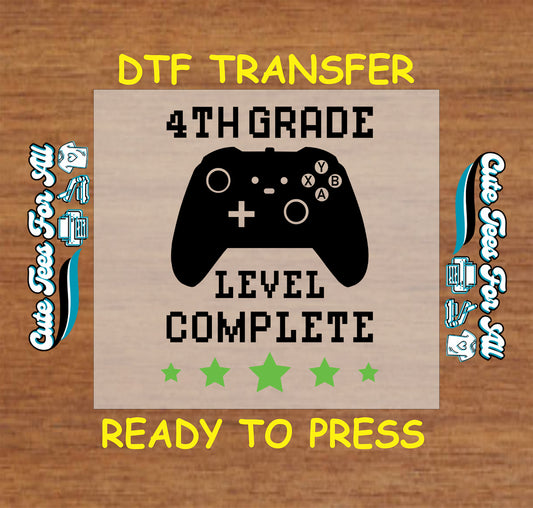 4th Grade Level Complete DTF transfer with black game controller and green stars.