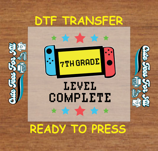 7th grade level complete DTF transfer with red and blue handheld gaming console and stars.