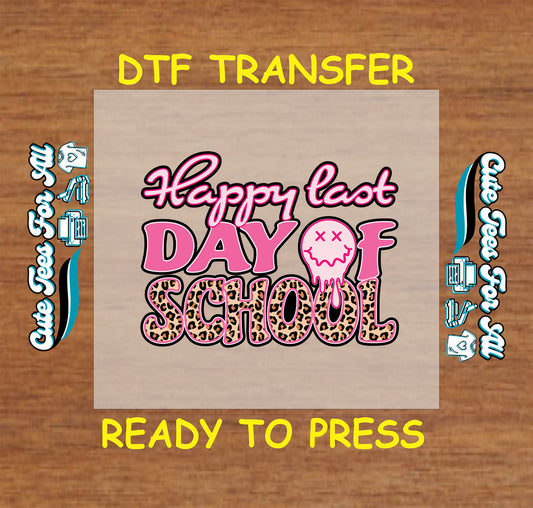 DTF transfer with "Happy Last Day of School" in pink bubble and leopard letters, dripping face graphic.