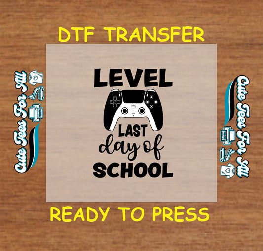DTF transfer with game controller and “Level Last Day of School” text in black.