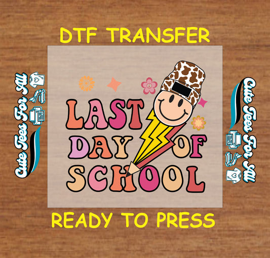 DTF transfer with “Last Day of School” text, smiley face in cheetah-print hat, lightning bolt, and flowers.