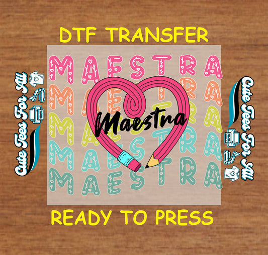 Stacked Maestra text with heart pencil overlay in colorful bilingual teacher DTF transfer.