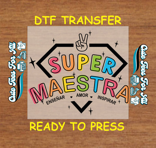 DTF transfer with the phrase "Super Maestra" in rainbow letters inside a superhero emblem with bilingual words.
