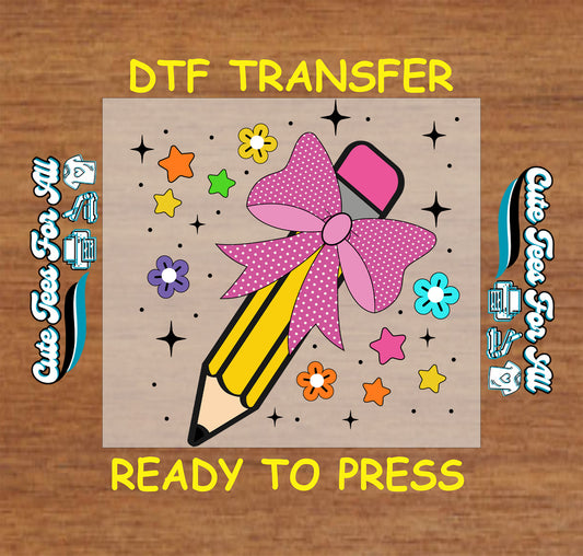 DTF transfer of yellow pencil with pink bow and colorful stars and flowers around it.