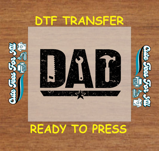 Distressed “DAD” text made of saw, wrench, and hammer icons with star underline.