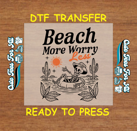 Skeleton relaxing in a float with text “Beach More Worry Less,” sun and desert plants.