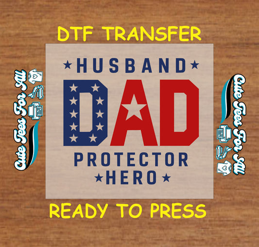 Red white and blue “Dad Protector Hero” graphic with stars and bold patriotic lettering.