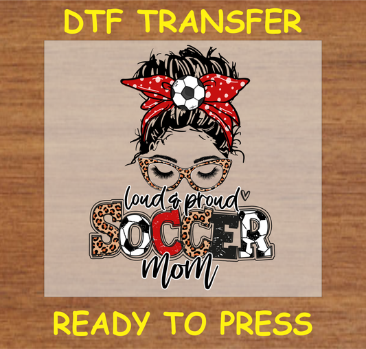 DTF transfer featuring the text 'Loud & Proud Soccer Mom' with soccer ball, leopard print, and glasses, perfect for custom apparel.