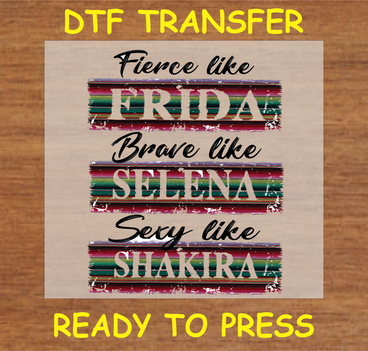 DTF transfer featuring the text 'Fierce like Frida, Brave like Selena, Sexy like Shakira' with colorful stripes, perfect for custom apparel.
