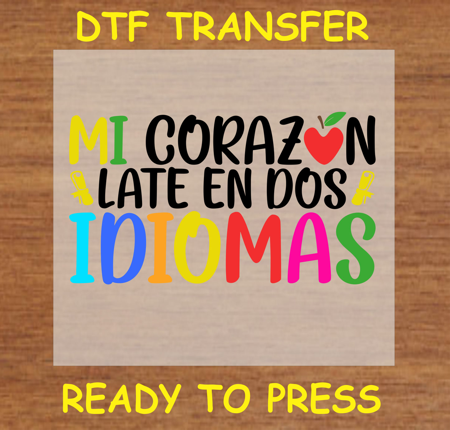 Mi Corazón Late en Dos Idiomas' DTF Transfer design with colorful text and an apple graphic, celebrating bilingualism. Ready to press