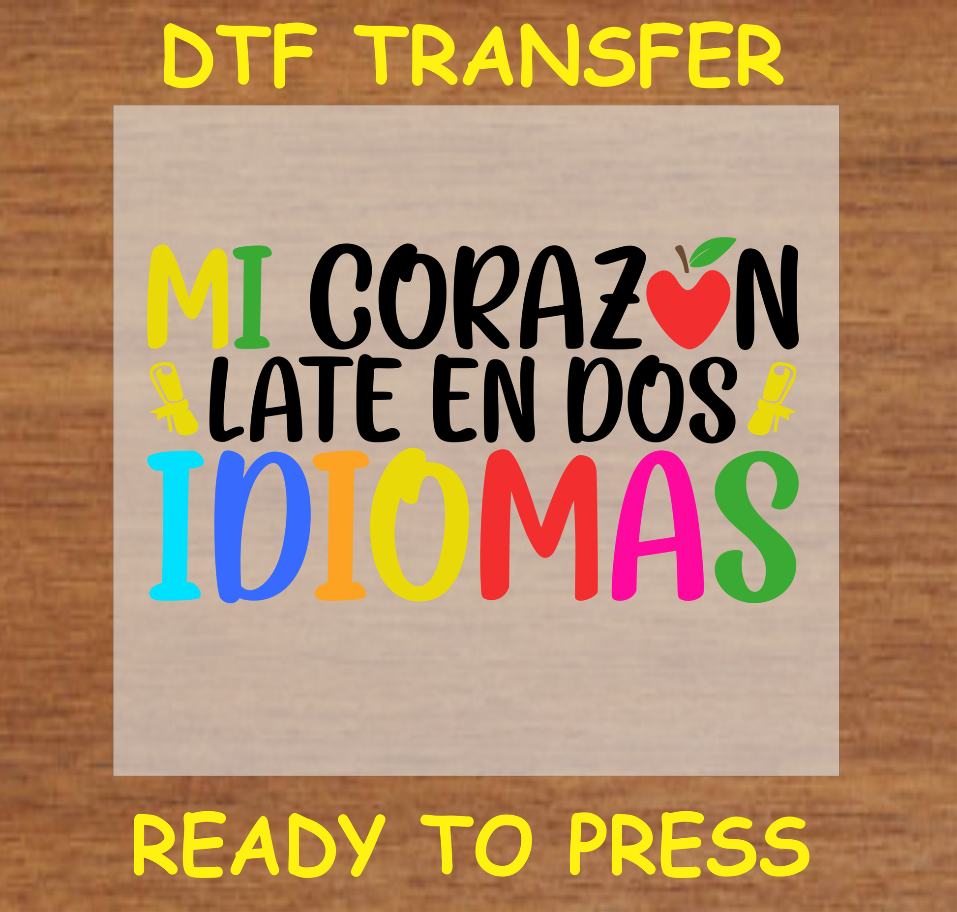 Mi Corazón Late en Dos Idiomas' DTF Transfer design with colorful text and an apple graphic, celebrating bilingualism. Ready to press