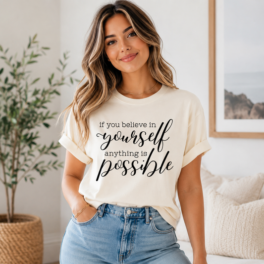 Cream shirt mockup featuring an inspirational ready to press dtf transfer with the phrase if you believe in yourself anything is possible in black typography.