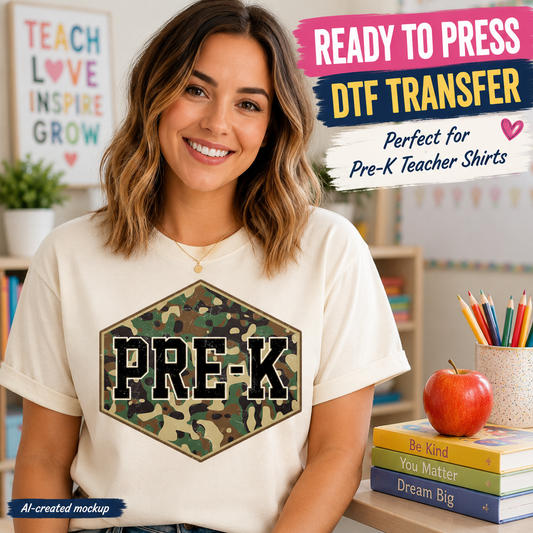 Woman wearing a t-shirt with 'PRE-K' design, surrounded by educational items in a classroom setting.