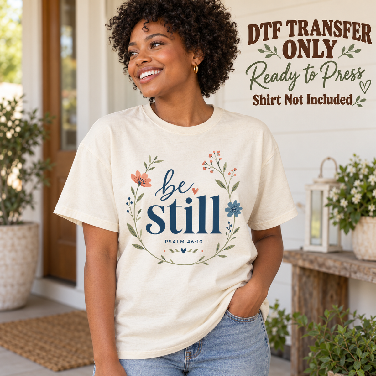 Christian Be Still Floral Psalm design shown on a cream shirt worn by a model; DTF transfer only, shirt not included.
