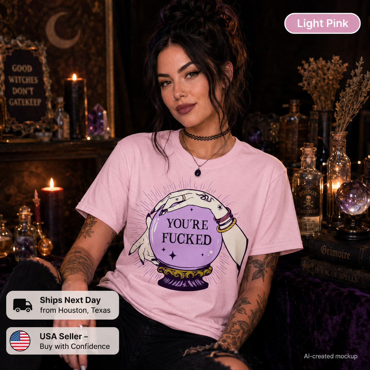 A woman wearing a light pink graphic t-shirt with a purple and white 'YOU'RE FUCKED' crystal ball design, set in a dark, mystical room with candles and occult decor. Features a 'Light Pink' label and shipping info badges.