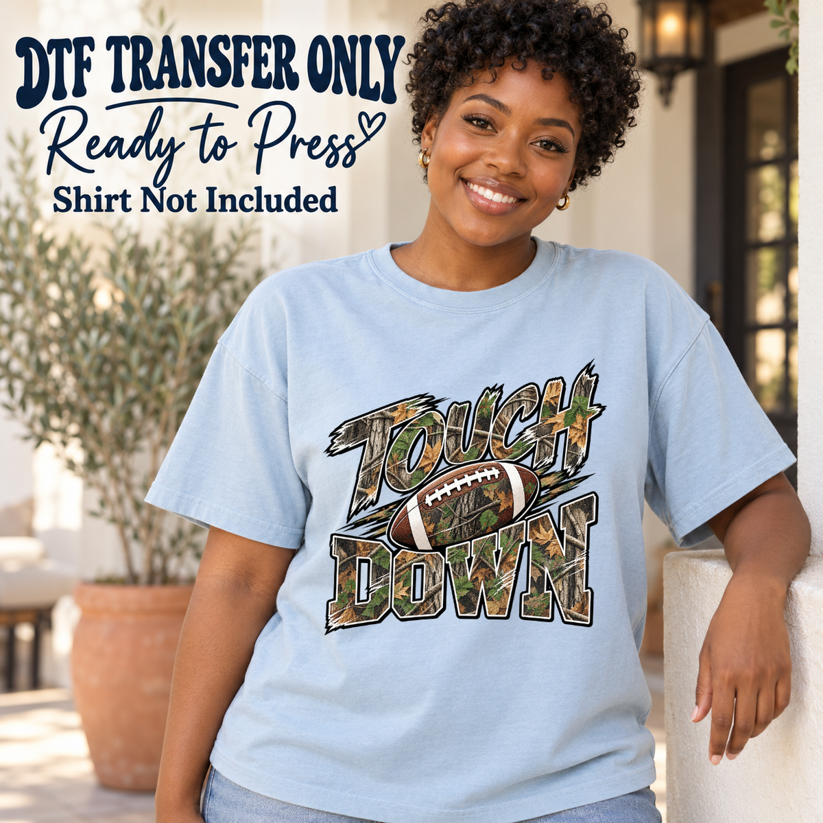 Football Touchdown Camo Letters design shown on a light blue shirt worn by a model; DTF transfer only, shirt not included.