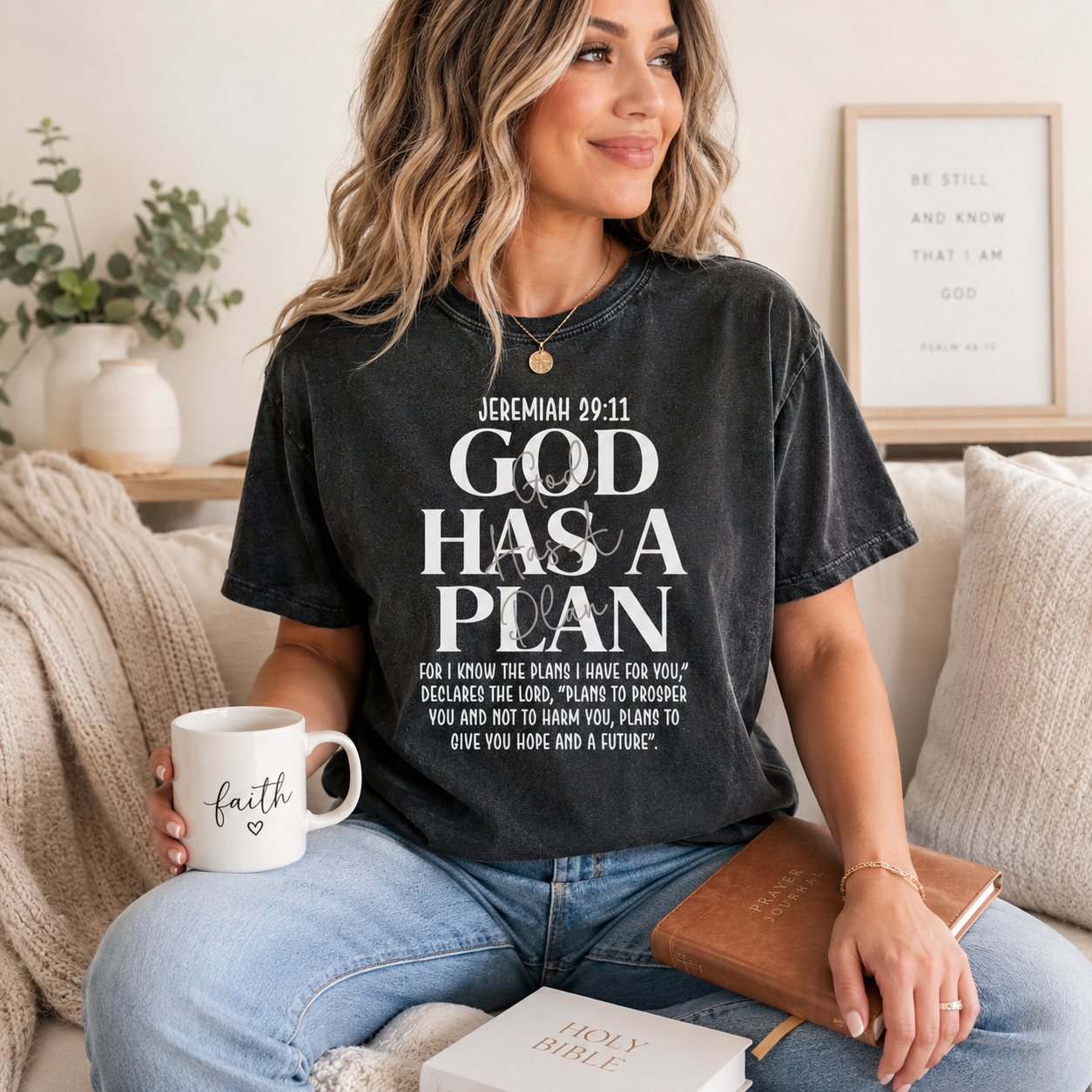 Black shirt mockup featuring a faith ready to press dtf transfer with the phrase God Has a Plan and Jeremiah 29:11 scripture-inspired white typography.