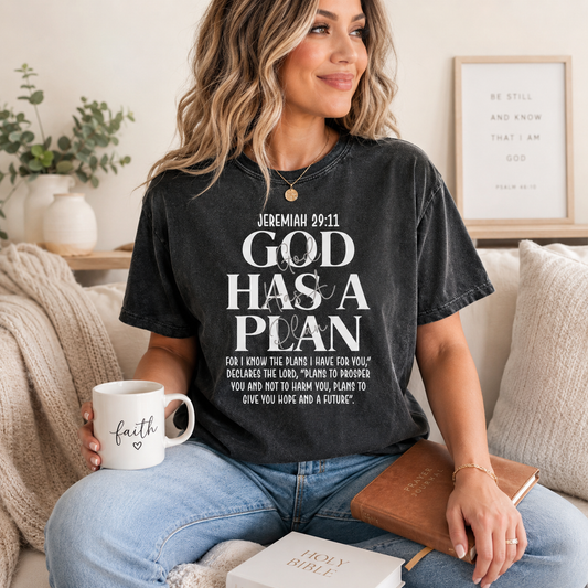 Black shirt mockup featuring a faith ready to press dtf transfer with the phrase God Has a Plan and Jeremiah 29:11 scripture-inspired white typography.