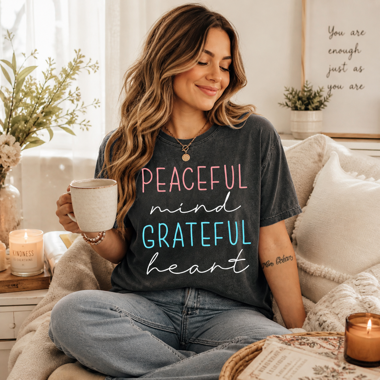 Black shirt mockup featuring an inspirational ready to press dtf transfer with the phrase Peaceful mind Grateful heart in soft pink, teal, and white lettering.